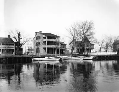 Old photo - 3 story wood structure along the water